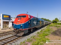 What Goes Up Must Come Down. With the prior day's run of the first Amtrak Maple Leaf (Train 63/VIA Rail Canada Train 98) returning to Toronto, Ontario for the first time since 2020, Amtrak 64/VIA Train 97 on Tuesday, June 28, 2022 was the first eastbound run. Amtrak 108 (P42DC, 50th Anniversary, Phase VI) was selected to lead the first full run to Toronto, which had been truncated between New York’s Penn Station and Niagara Falls, New York due to pandemic related service cuts. The train is seen passing through the Grimsby, Ontario VIA Station, a clear indication that it is not in the United States. 

More on the Maple Leaf return:
https://media.amtrak.com/2022/06/amtrak-maple-leaf-travelers-can-now-buy-tickets-to-and-from-toronto-with-service-set-to-resume/

More on Amtrak's Commemorative 50th Anniversary Locomotives: 
https://media.amtrak.com/2021/03/amtrak-releasing-six-50th-anniversary-commemorative-painted-locomotives/