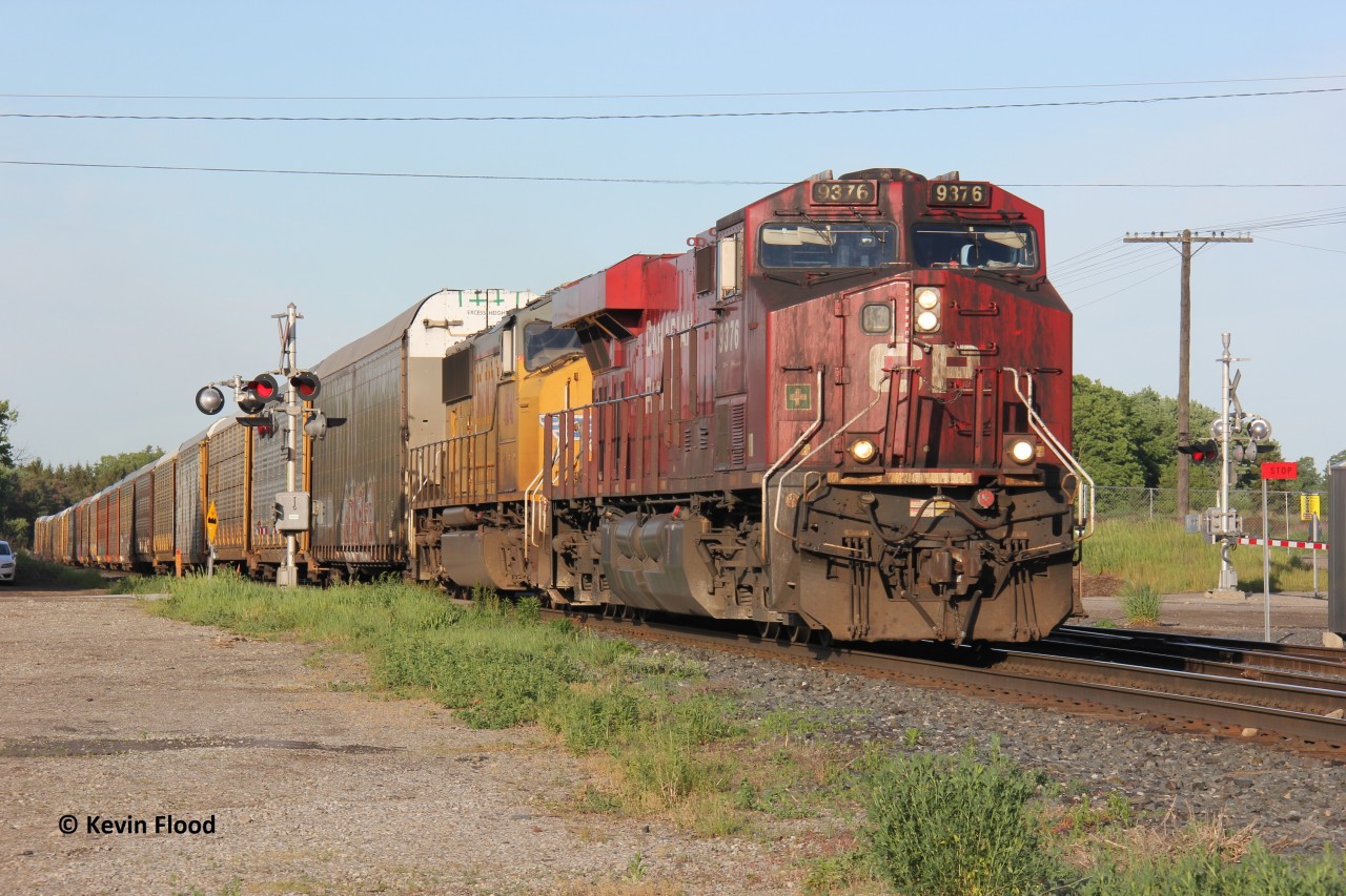 CP 244 (now CP 234) was underway after working Wolverton, crossing Northumberland St. in Ayr, ON. Power was grimy/coal-stained CP 9376 and UP 4041. I was hoping to catch this train with the UP 4041 solo, but unfortunately, CP added this "pride-of-the-fleet" leader either in London or Wolverton.