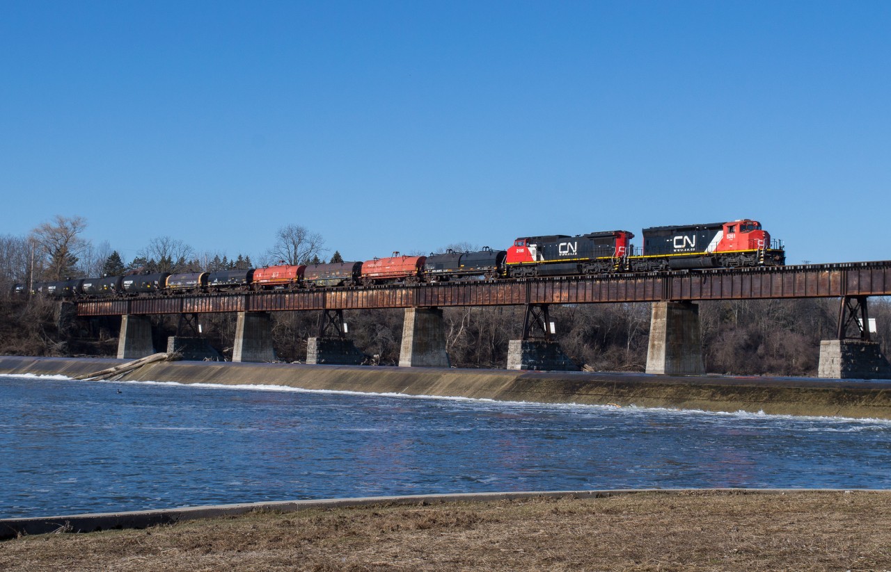CN A401 makes a rare daylight appearance in Caledonia on a gorgeous March morning with CN 5261 and CN 2195 leading the train for Sarnia.  CN's return to the Hagersville Subdivision has brought some interesting engines down the line much to the enjoyment of many railfans.