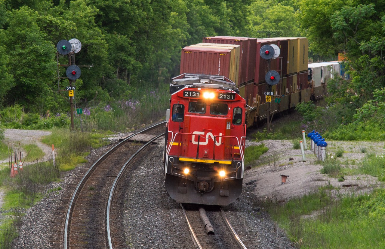 CN Z148 splits the signals at Copetown with CN 2131 leading the charge.