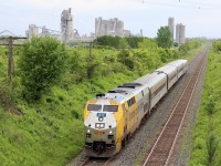 The St. Mary’s cement plant near Bowmanville almost looks like a city of its own. I’ve always wanted to work it into a photo and luckily this new location for me works out decently. Here an eastbound VIA races along CN’s Kingston subdivision. The overgrown service track in the distance makes it look as though CN no longer services the facility but thankfully that us incorrect considering the cut of cars barely visible within the plant. 