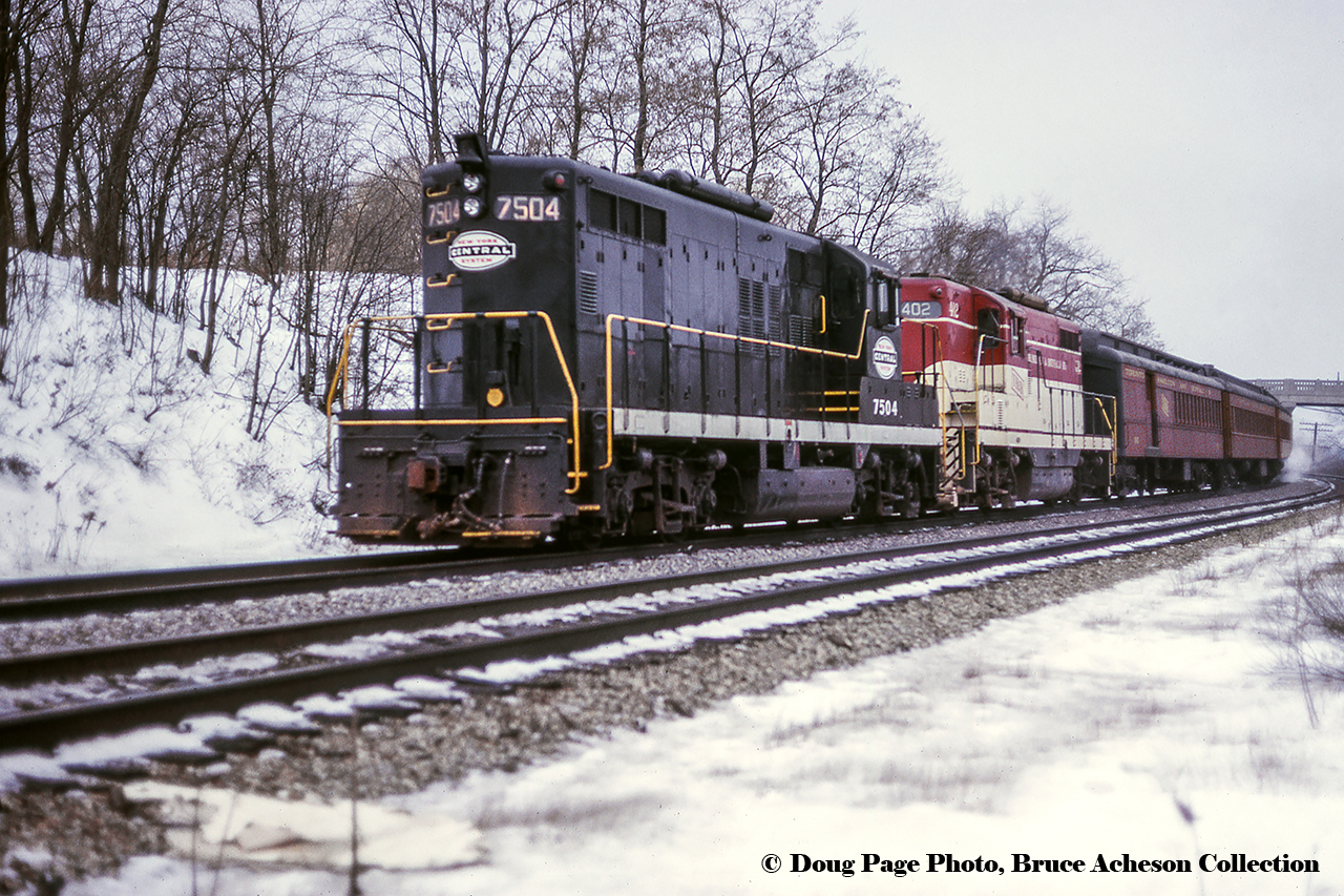 January 14, 1967 was a special day for fans of the Toronto Hamilton & Buffalo Railway, as the Upper Canada Railway Society ran an excursion covering TH&B and NYC lines (NYC owning 73% of the TH&B, CPR the other 27%) in Southern Ontario, and included utilizing an NYC GP9 on the point. Here, the train has finished the first leg of it’s trip from Hamilton – Waterford via Brantford.  Now on the CASO just east of the Main Street overpass, it will run east on the NYC to Welland, turning back west on the TH&B for the final leg, Welland - Hamilton.More of this excursionWaiting to depart Hamilton, Doug PageClimbing the grade at Summit, Doug PageAnother angle at Summit, Bill ThomsonDoug Page Photo, Bruce Acheson Collection Slide.