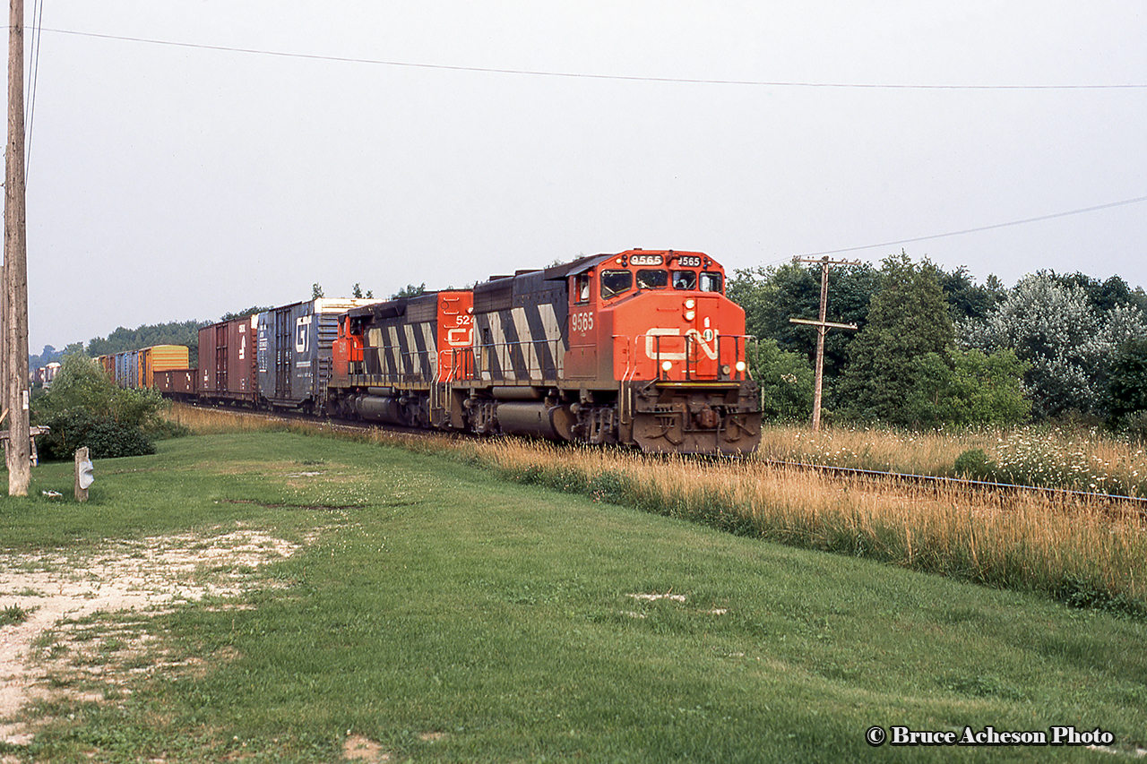 A pair of Canadian cabs lead CN 431 through Rockwood.  Leader 9565 would be retired in September 1996 and rebuilt as a GP40-2LH for the Massachusetts Bay Transit Authority 1129 and remains in service today.  Trailing  SD40-2W 5241 retired in 2010.