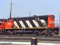 CN M420 3522 at Mac Yard’s diesel shop.  Originally CN 2522, 3522 would be retired in March 1998 and sold a few months later to National Railway Equipment in Silvis, Illinois. It would be picked up by the <a href=http://capecodrails.railfan.net/cccx/ccc2000s.jpg>Cape Cod Central Railroad becoming their 2000</a> for a couple of years before returning to Canada and heading for the prairies as <a href=http://www.railpictures.ca/?attachment_id=25117>Great Western Railway 2000.</a> The GWR retired it’s MLW fleet in recent years, with the 2000 moving east to Manitoba, now on the Keewatin Railway’s roster as their 2404.