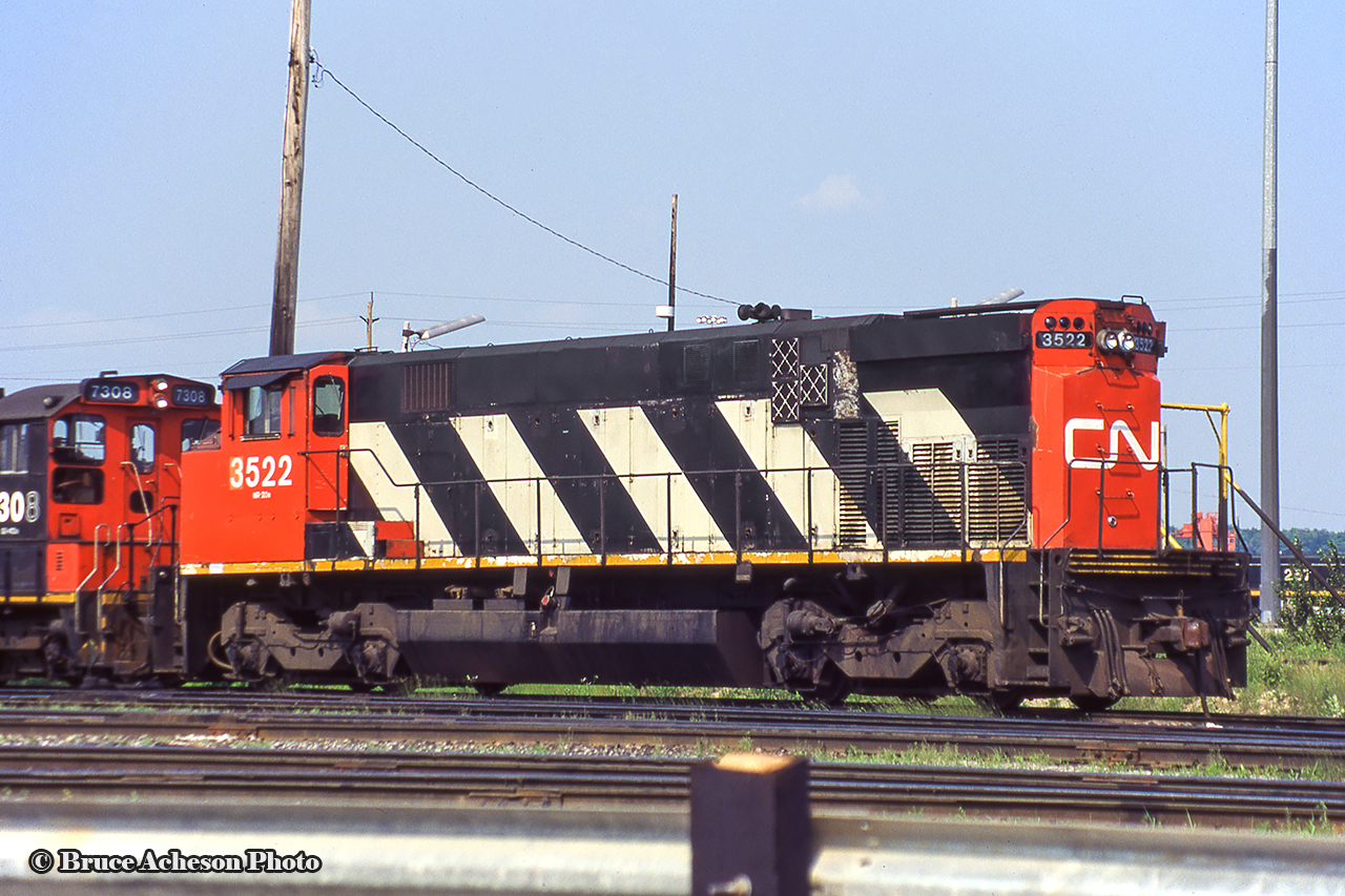 CN M420 3522 at Mac Yard’s diesel shop.  Originally CN 2522, 3522 would be retired in March 1998 and sold a few months later to National Railway Equipment in Silvis, Illinois. It would be picked up by the Cape Cod Central Railroad becoming their 2000 for a couple of years before returning to Canada and heading for the prairies as Great Western Railway 2000. The GWR retired it’s MLW fleet in recent years, with the 2000 moving east to Manitoba, now on the Keewatin Railway’s roster as their 2404.