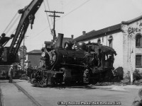 Mid day on May 27, 1953 found downtown Hamilton with quite a spectacle as CNR E-10-a 2-6-0 Mogul 88, the lead locomotive on a double headed freight up the mountain, <a href=http://www.railpictures.ca/?attachment_id=43925>was tossed on her side</a> at the intersection of Ferguson Avenue and Rebecca Streets. This derailment was caused by the lead wheels of 88's tender picking the switch of the Rebecca Street spur, jackknifing the engine causing it to flip. The three crew members onboard; Engineer Charles Penfold (jumped clear), Fireman Richard Day, and head end Brakeman Murray Calder, all escaped with minor injuries.  The trailing engine 3506 followed 88 down the spur stopping short of the yard engine working nearby industries. After 3506 and the rest of the train returned to Hamilton Yard after the derailment while the hook works to get 88 back on the rails.<br><br>CNR 88, built as Grand Trunk 1008 by CLC in 1910, renumbered GTR 910 in 1919, CNR 910 in 1923, and CNR 88 in 1951. After this wreck, which cracked the crown sheet atop the firebox, 88 would be sent to Stratford for repairs. Retired in 1957, she would be placed on display <a href=http://www.railpictures.ca/?attachment_id=24212>as GTR 1008 just east of Morrisburg, Ontario</a> along Highway 2 near the Upper Canada Pioneer Village. Along with it sits the historic Aultsville train station and two GTR coaches. CNR S-1-g Mikado 3506, built by CLC as GTR 486 in 1917, would be scrapped just over 4 years later in July, 1957.