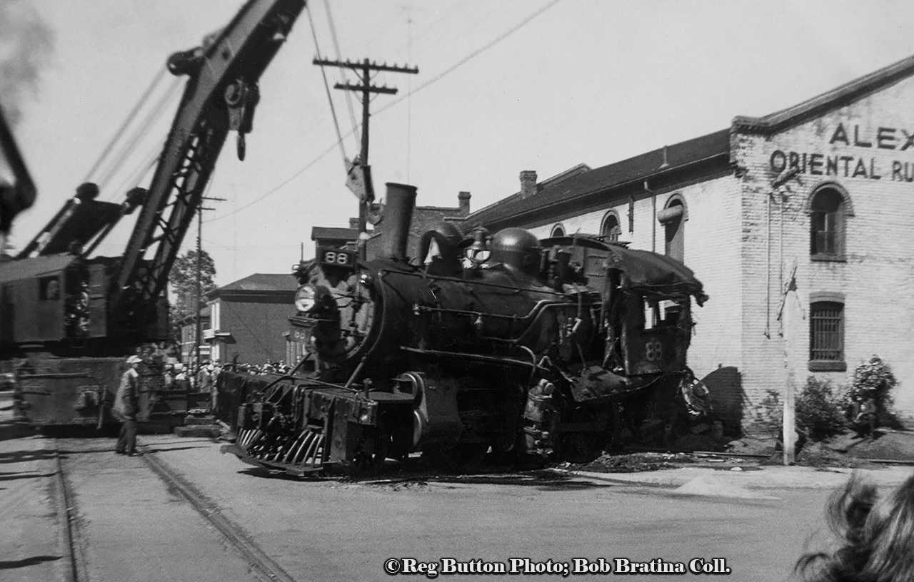 Mid day on May 27, 1953 found downtown Hamilton with quite a spectacle as CNR E-10-a 2-6-0 Mogul 88, the lead locomotive on a double headed freight up the mountain, was tossed on her side at the intersection of Ferguson Avenue and Rebecca Streets. This derailment was caused by the lead wheels of 88's tender picking the switch of the Rebecca Street spur, jackknifing the engine causing it to flip. The three crew members onboard; Engineer Charles Penfold (jumped clear), Fireman Richard Day, and head end Brakeman Murray Calder, all escaped with minor injuries.  The trailing engine 3506 followed 88 down the spur stopping short of the yard engine working nearby industries. After 3506 and the rest of the train returned to Hamilton Yard after the derailment while the hook works to get 88 back on the rails.CNR 88, built as Grand Trunk 1008 by CLC in 1910, renumbered GTR 910 in 1919, CNR 910 in 1923, and CNR 88 in 1951. After this wreck, which cracked the crown sheet atop the firebox, 88 would be sent to Stratford for repairs. Retired in 1957, she would be placed on display as GTR 1008 just east of Morrisburg, Ontario along Highway 2 near the Upper Canada Pioneer Village. Along with it sits the historic Aultsville train station and two GTR coaches. CNR S-1-g Mikado 3506, built by CLC as GTR 486 in 1917, would be scrapped just over 4 years later in July, 1957.
