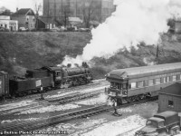 CNR P-5-f, 0-8-0 switcher 8361 works traffic around Hamilton yard while a passenger train makes a stop at CNR’s James Street station with a GTW business car brining up the rear.  Perhaps this train will back out to Bayview and proceed west to Sarnia and into the states.  Built by MLW in May, 1929, 8367 will be scrapped in February 1959.