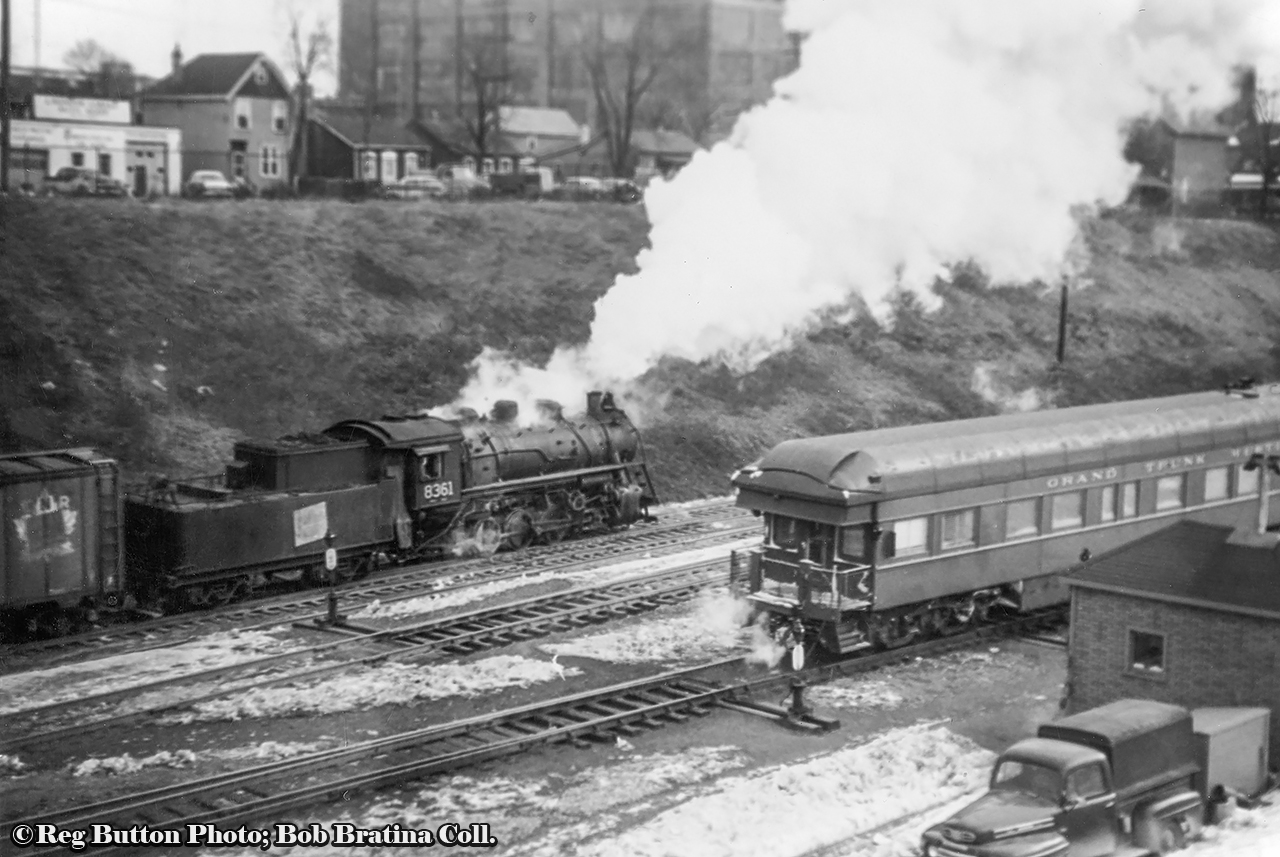 CNR P-5-f, 0-8-0 switcher 8361 works traffic around Hamilton yard while a passenger train makes a stop at CNR’s James Street station with a GTW business car brining up the rear.  Perhaps this train will back out to Bayview and proceed west to Sarnia and into the states.  Built by MLW in May, 1929, 8367 will be scrapped in February 1959.