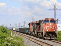 A new location for me. I don’t often make it to Aldershot before CN 421 is long gone. Today I got my chance to catch 421 on the grimsby subdivision with it running a bit later then normal, with him working Hamilton yard I got a chance to explore a bit  and I finally got to see the new GO transit storage yard in Stoney Creek. Here CN 421 is back up to track speed as it storms away from cloud filled skies. The signals in the distance protect the entrance to the storage yard. 