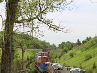 Somehow this is only my second visit here, considering the number of trips I have taken to Newtonville over the years. Beare is a very unique location thanks to CP’s Belleville subdivision crossing overhead. Here CN 105 with a pair of ex CREX Gevo’s up front has just missed the tail end of Cp H27 a minute earlier. It is so nice to finally be surrounded by lush greenery again after all these winter months. 