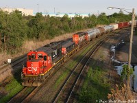 Harder and harder to find on the mainline compared to years past, SD40's still hold down assignments on CN here and there, including working the hump at CN's sprawling MacMillan Yard north of Toronto. On a warm summer evening, just such a pair push a cut of cars down the pullback track at the north end of the yard: SD40-2Q 6020 (originally built as CN SD40 5114), slug 279 (ex-GP9 4452) and SD40-2W 5298, still sporting its original "factory fresh" stripes. CN 7500-series GP38-2's and 500-series hump slugs once held down these assignments for many decades (replacing the old MLW S13 and slug sets that the hump began with in the mid-1960's).