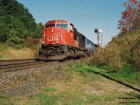 CN 385 is just west of Dundas, Ontario viewed at Mile 7 on the Dundas Subdivision as it slowly approaches the Middletown Road overpass with 5607, GATX 3702 and 9665 during a fall afternoon. 