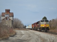 CP 420 with Script heritage SD70ACU 7011 on point rolls past the abandoned grain elevator in Kleinburg, ON in full dynamics. The head end passed during a rare moment of sunshine on a mostly cloudy March 18th.