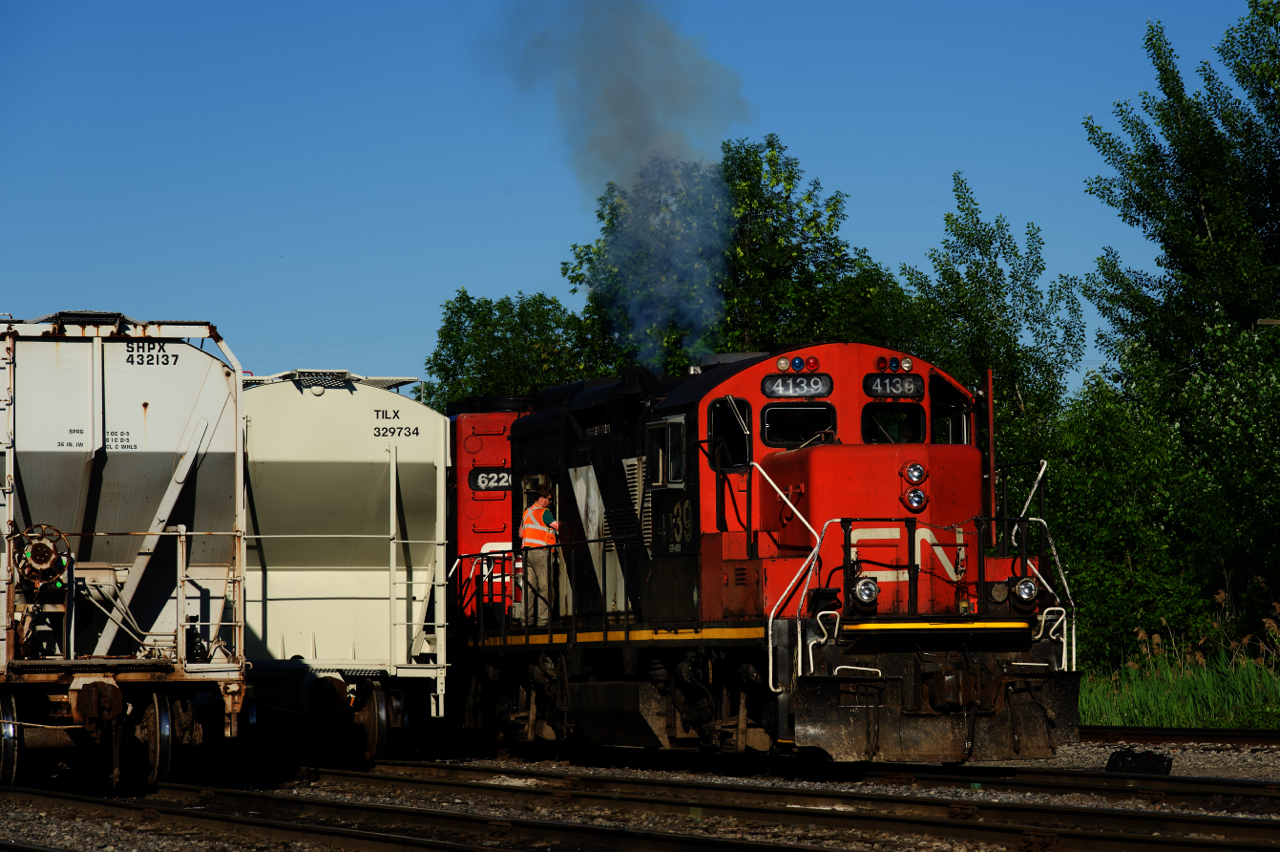 Smoke emerges from CN 4139 as CN 536's engineer starts it up at the start of his shift.