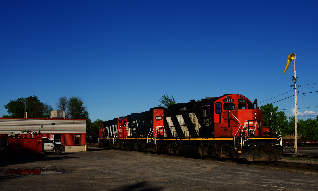 CN 536's engineer has spotted his power (CN 4139, GTW 6226 & CN 9410) behind Coteau Station at the start of his shift; soon the rest of the crew will board and they will head to Coteau Yard to do some switching.