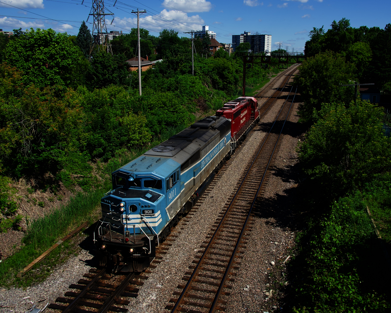 CMQ 9011 and ex-SOO CP 6607 are southbound on the Adirondack Sub, on their way to pick up a rail train at Farnham for the Lacolle Sub.