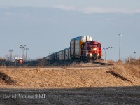 A throwback to when both CP and CN serviced the CAMI auto compound. CP's afternoon Woodstock job is in the process of backing in a string of auto's while the top of CN GP9RM 7025 can be seen in the distance to the left. On December 14, 2009 both CN and CP would disappear from the scene and Ontario Southland would take over the switching contract delivering auto's to CN in Ingersoll and CP in Woodstock. As of 2022 the plant will switch to producing fully electric commercial vehicles which is rumoured not to require rail service. Clarification from anyone is welcome!