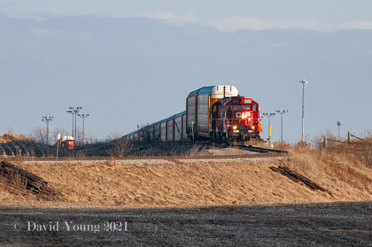A throwback to when both CP and CN serviced the CAMI auto compound. CP's afternoon Woodstock job is in the process of backing in a string of auto's while the top of CN GP9RM 7025 can be seen in the distance to the left. On December 16, 2009 both CN and CP would disappear from the scene and Ontario Southland would take over the switching contract delivering auto's to CN in Ingersoll and CP in Woodstock. As of 2022 the plant will switch to producing fully electric commercial vehicles which is rumoured not to require rail service. Clarification from anyone is welcome!