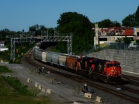 Grain train CN 878 has CN 2827 and CN 3224 up front (and CN 2538 on the tail end) as it approaches Turcot Ouest a bit over fifteen minutes after CN 120 passed.