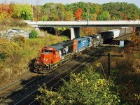 CN 387 with GTW 5920, GTW 5819 and NS 8051 is viewed heading westbound through Bayview Junction on the Oakville Subdivision during a sunny fall morning. The same power was photographed the previous day on CN 392 working Brantford yard on the Dundas Subdivision. 
