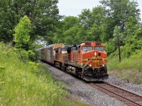 I had know this CP 234 was making its way eastward as a solo BNSF 4739 but was thinking, as usual, it will terminate before it gets here. I was doing a bit of yard work when a got a message that it had arrived at Galt so I headed off to this close spot to catch it figuring I had plenty of time. I parked the truck and got out to the sound of a horn at Victoria Road so I raced through the grass and barely got in to position for this shot. UP 7467 was added to the power to make this even better. The tracker is a great thing but sometimes its off by a bit and can give us all fits.