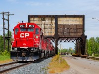 As mentioned <a href="https://www.railpictures.ca/?attachment_id=49095" target="_blank">here</a>, the successor the CN U701, CP 822, arrived into Thunder Bay with 100 coke loads for TBTL on June 18. On the afternoon of June 19, the 0630 Yard Job went over light power McKellar Island to retrieve the train. If you look through the bridge to the right, you can see a view of the cars used for the operation - the same type used on the CN trains. <br><br> This had been a rather stormy day up until this photo, and a series of delays over at TBTL allowed enough time for some sun to come out for this shot.