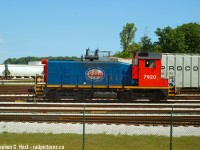 This was the only time I shot the ESSO Switcher in service in Sarnia, now <a href=http://www.railpictures.ca/?attachment_id=49123 target=_blank>LDSX 7920 and painted in GIO's tasteful grey scheme.</a>. This unit was out of service not long after this picture was taken and sat at the LDS shop for about 10 years before it was finally repaired, repainted and put back into service. The Esso scheme was rather nice however.