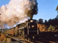 It’s just after 7am as U-2-g 6228 leads Train 94, the joint Lehigh Valley/Canadian National Maple Leaf through Bayview Junction for Toronto with the usual red Lehigh Valley combine up front along with Pullman sleepers filling out the consist alongside the CNR cars.  More of the typical consist of this train <a href=http://www.railpictures.ca/?attachment_id=46298>can be seen in this shot here at Toronto.</a><br><br><i>Original Photographer Unknown, Jacob Patterson Collection Slide.</i>