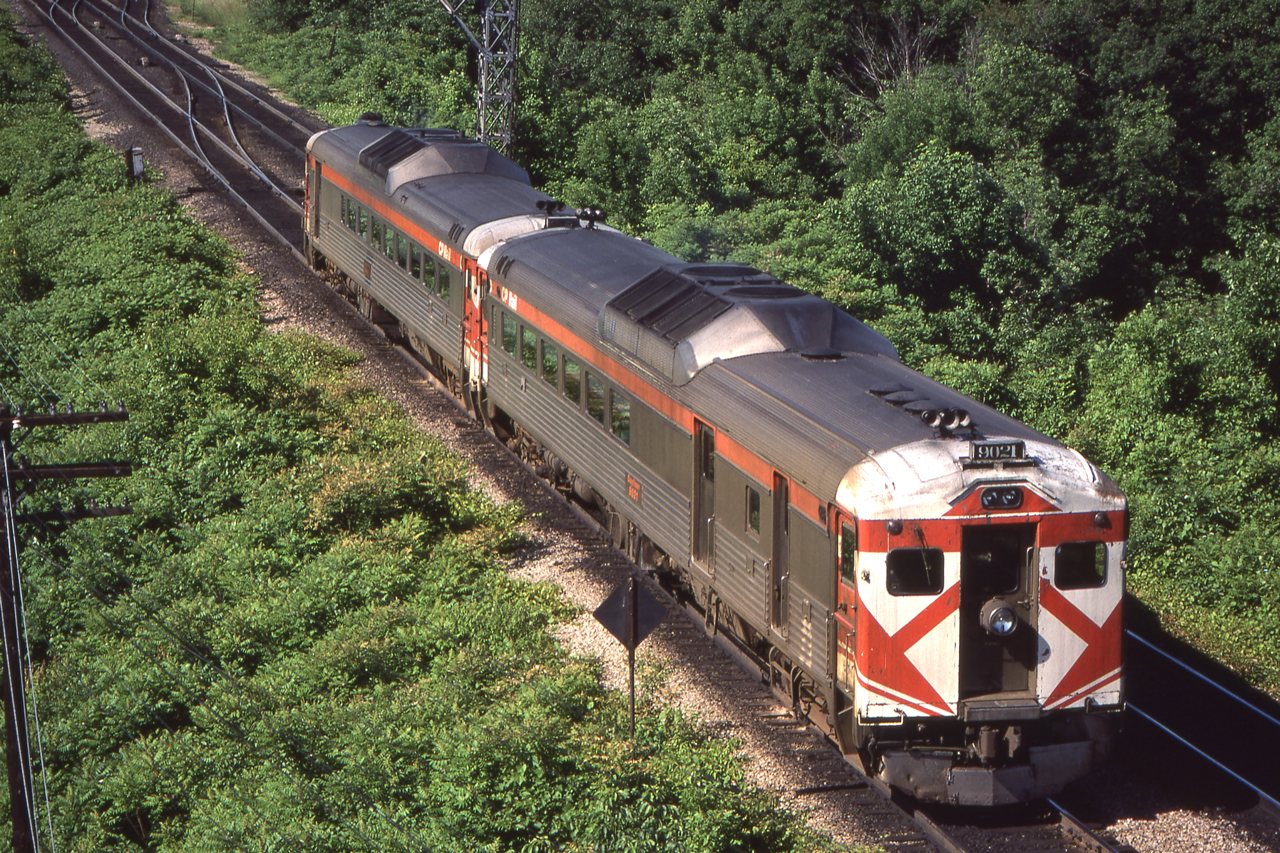 An eastbound VIA train with CP 9021 on the point is leaving Bayview Junction, Ontario on June 21, 1980.