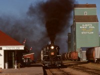 At Stettler in central Alberta, the Central Western Railway hosted Alberta Prairie railtours powered by 1920 Baldwin 2-8-0 number 41 (originally Jonesboro, Lake City & Eastern in Arkansas), seen here arriving southward enroute Big Valley on Saturday 1991-10-05 at 1725 MDT.