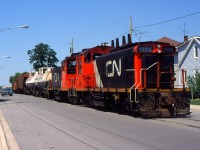 CN 549 with CN 1388 and CN 1385 returning back to Merritton. The Paper Mill is gone and the Pine St. Lead has also been removed.