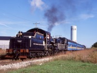 I do really miss  these days the special runs that ETR 9 did back in the early 2000’s when it was assigned to the St. Thomas Central. Between the Cayuga subdivision to the east if St. Thomas and the CASO subdivision to Shedden, the old steamer from time to time really got to stretch its legs. It’s so sad that CN wouldn’t give the museum the section of the CASO to Shedden, and even today most of the Cayuga subdivision east of Tilsonburg is gone or on the verge of abandonment. Today ETR 9 is operated many miles away up in St. Jacob’s, and is well looked after. Back in 2002 #9 ran a few specials to Delhi and back, with only one customer served in town , the writing back then was in the walls for this portion of the line, and when Trillium gave up the line years ago the last customer switched to trucks. Here ETR 9 has just run around its train at the east end of Delhi and is heading back to St. Thomas, with Delhi’s unique water tower in the distance. In 2021 a contractor finally began lifting the long out of service here and in spring of 2022 the large bridge over a creek in the west end of town was removed totally eliminating any chance of a revival of rail service here. 