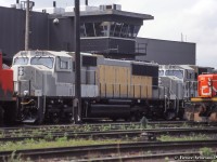 A scene on the Mac Yard power tracks finds GP40-2LW 9617 along with new SD70Is 5601, 5603 in primer and slug 259.  Three of the 4 units remain on the roster.  Slug 259, formerly <a href=http://www.railpictures.ca/?attachment_id=43792>CN 4609, originally NAR 211.</a>  9617 would be off the CN roster the following year, sold in 1996 to HELM for use by <a href=http://www.rrpicturearchives.net/showPicture.aspx?id=1429745>KCS as 4715,</a> later rebuilt to a GP40-3 and numbered KCS 2913.  It remains in service as of 2021.