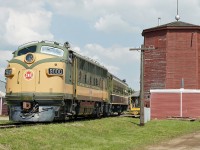 Canada Day long weekend saw the museum operating it's passenger train.  Seen here passing the water tower which dates from 1919 in Gibbons and was acquired by the museum in 1984.