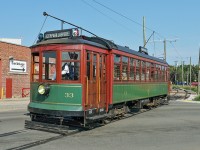 Edmonton streetcar No. 33 crosses 103 St. (Gateway Boulevard) as it makes it's way to the Whyte Avenue terminus of Edmonton Radial Railway Society's High Level Bridge route. Built in 1912 by the St.Louis Car. Co. in Missouri, USA she ran in Edmonton from 1912 until withdrawal in 1951.