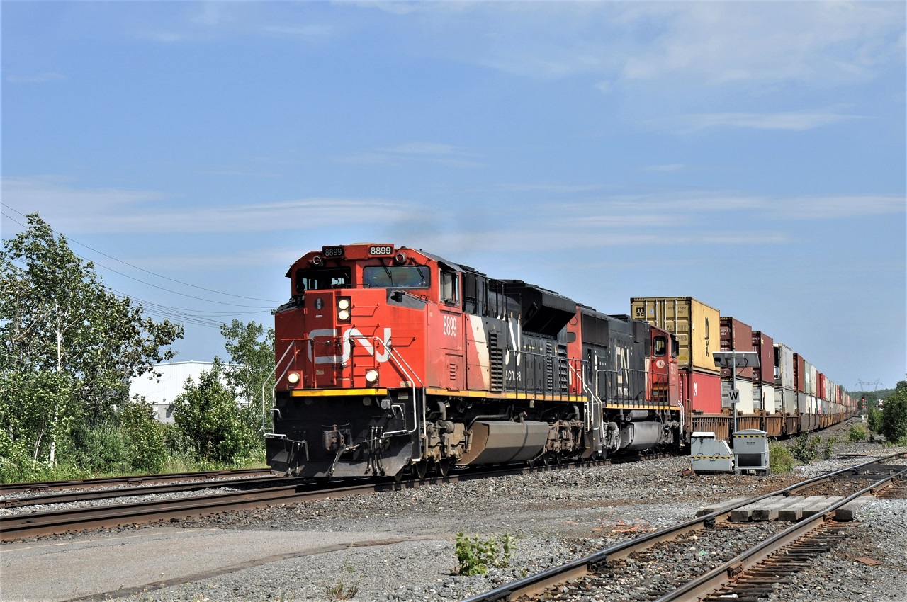 One of CN's many intermodal trains roars through Sudbury (Jct) ON on its way west.
