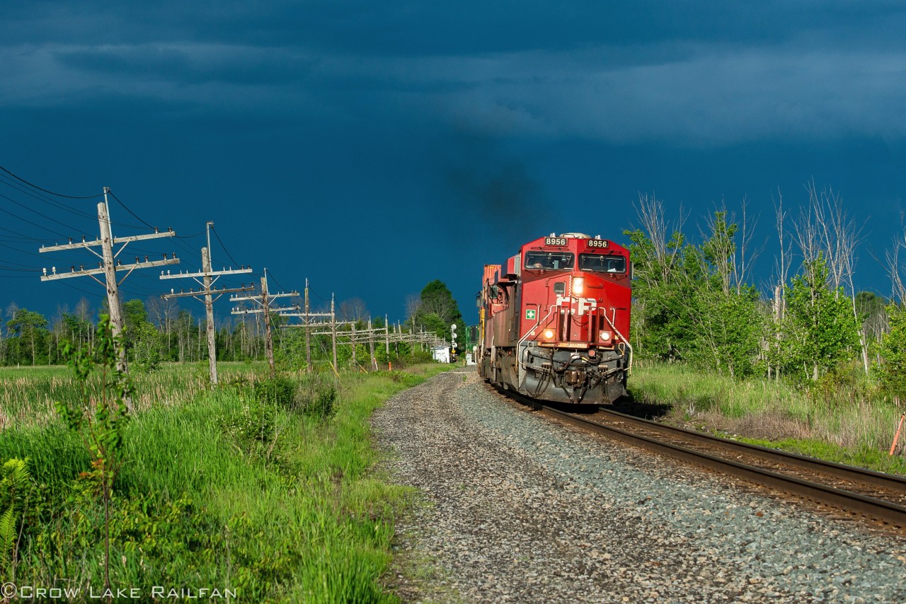 CP 133 notches up as it departs Smiths Falls with quite the storm clouds in the background. Somehow the storm eluded Smiths Falls by going just north leaving clear skies after.