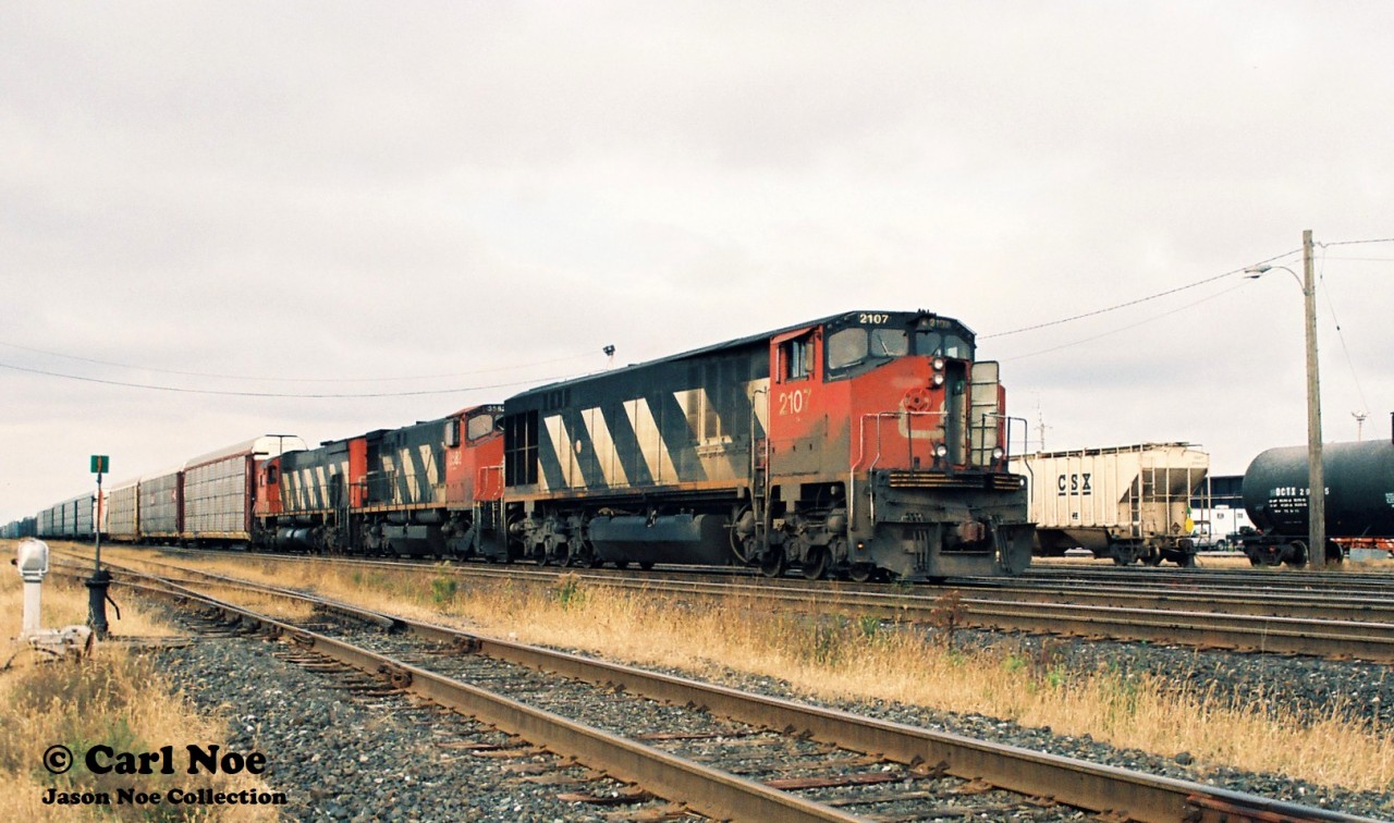 CN #308 is viewed pausing at Belleville, Ontario on CN’s Kingston Subdivision. The consist included; CN 2107, 3582 and 2313. CN M636’s 2313, 2323 and 2338 were officially re-retired on August 19, 1996; however they were un-retired on September 20 for the second time. CN 2313 would be officially retired for the final time on October 29, 1996 and sold to Cyclomet X for scrapping.