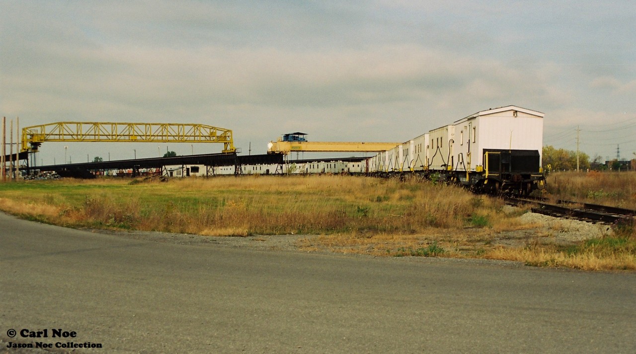 A brief sunny break on an otherwise cloudy fall morning illuminates a CN work train stored in the railway’s Belleville, Ontario yard.