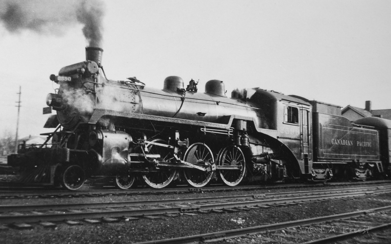 I have a small number of what appears to be contact prints of various rail scenes taken by my Dad. The time of these photos, with fairly good certainty, will be sometime after WWII till the early 50's. Location, some will be here in Alberta, but, family trips were made down east during this time too, so Canada. The actual history behind the photos has been lost with the passing of their generation. I hope they are enjoyed. A Micro-Nikkor 55mm f2.8 AIS lens with pk-13 tube attached, all mounted on a D810, was used for reproduction.
