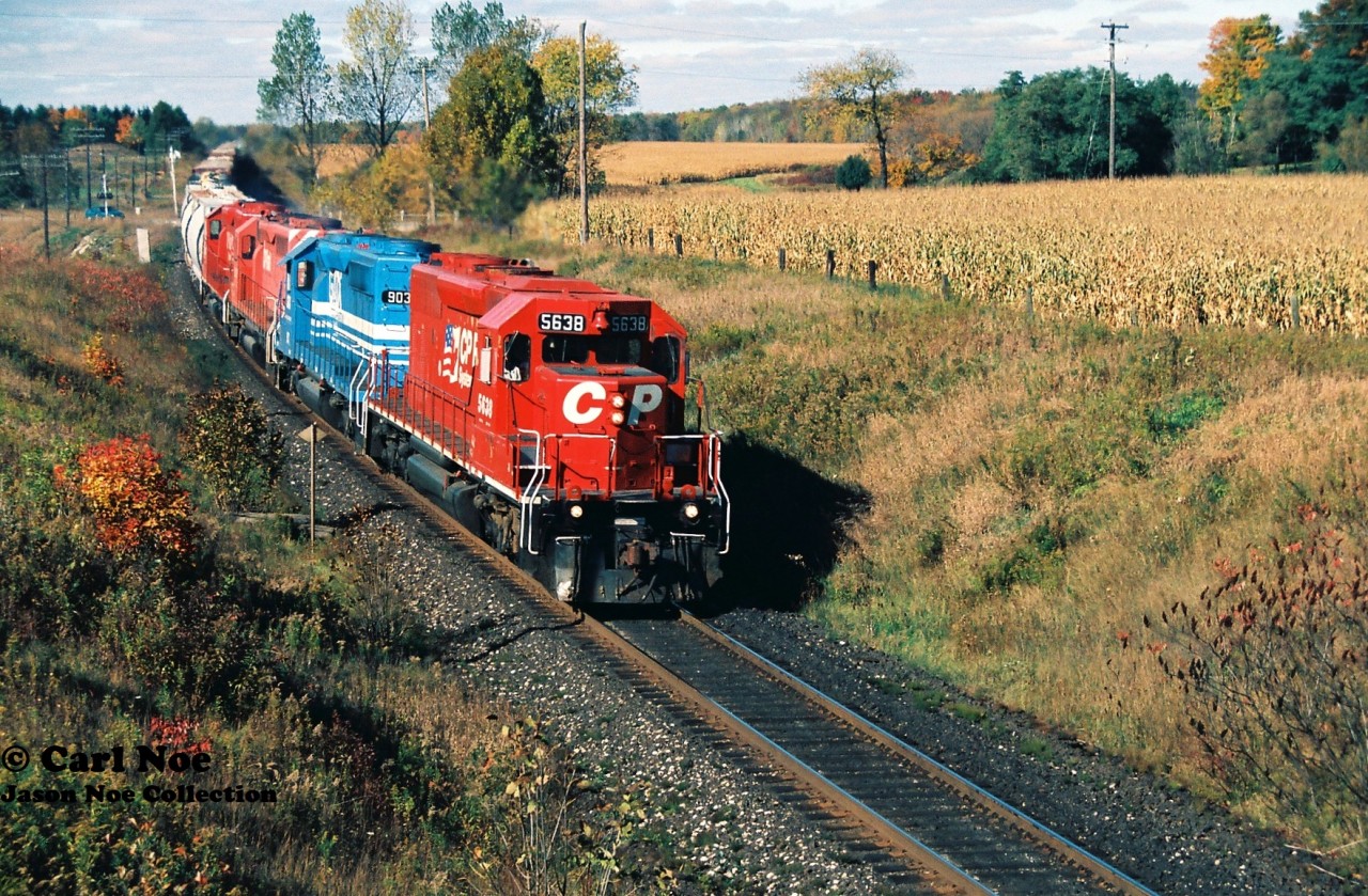 CP 270 is crossing Highway #2 just west of Woodstock as it heads eastbound with 5638, GATX 903, 5526 and 5567 during a fall morning.