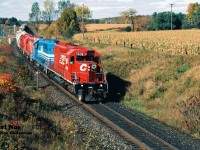 CP 270 is crossing Highway #2 just west of Woodstock as it heads eastbound with 5638, GATX 903, 5526 and 5567 during a fall morning. 