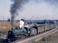 CNR J-4-d Pacific 5114, built by MLW in August 1919, has just departed Niagara Falls station with train 91 at 1635h about to pass beneath the Victoria Avenue overpass, a common vantage point for shooting the <a href=http://www.railpictures.ca/?attachment_id=17685>Niagara Falls CN yard.</a>  Train 91 is due into Hamilton at 1830h, where it will depart for Toronto at 1840h as train 92, arriving in Toronto at 1950h.  CNR 5114 is now <a href=https://scontent-yyz1-1.xx.fbcdn.net/v/t1.6435-9/67550905_10157250609735132_6914016629156216832_n.jpg?_nc_cat=106&ccb=1-7&_nc_sid=825194&_nc_ohc=5zXN-JjrZdoAX-2LBUZ&_nc_ht=scontent-yyz1-1.xx&oh=00_AT_5hhUgly1gp5JHqGefINphFszz5XDgUfrQFyfVG8GpbQ&oe=62C82188>preserved at Melville, Saskatchewan.</a><br><br><i>Original Photographer Unknown, Al Chione Duplicate, Jacob Patterson Collection Slide</i>