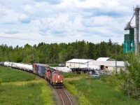 After a hectic week of failures, reroutes and delays, the 2022 CN Weed Spray train rolls down the Bala Subdivision past the Alliance Agri-turf facility in Mount Albert, ON. CN 5722 was put on the head end in Washago earlier that day after CN 5349 ran out of cooling water, adding to the long list of problems this train experienced on its way south.