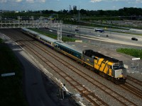 VIA 69 passes Turcot Ouest with VIA 6437 and four LRC cars.