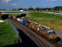CN 527 has pair of CREX units followed by a pair of geeps (CN 3944, CN 3936, CN 4134 & CN 4900) as it backs up towards Track 29 to set off cars there.
