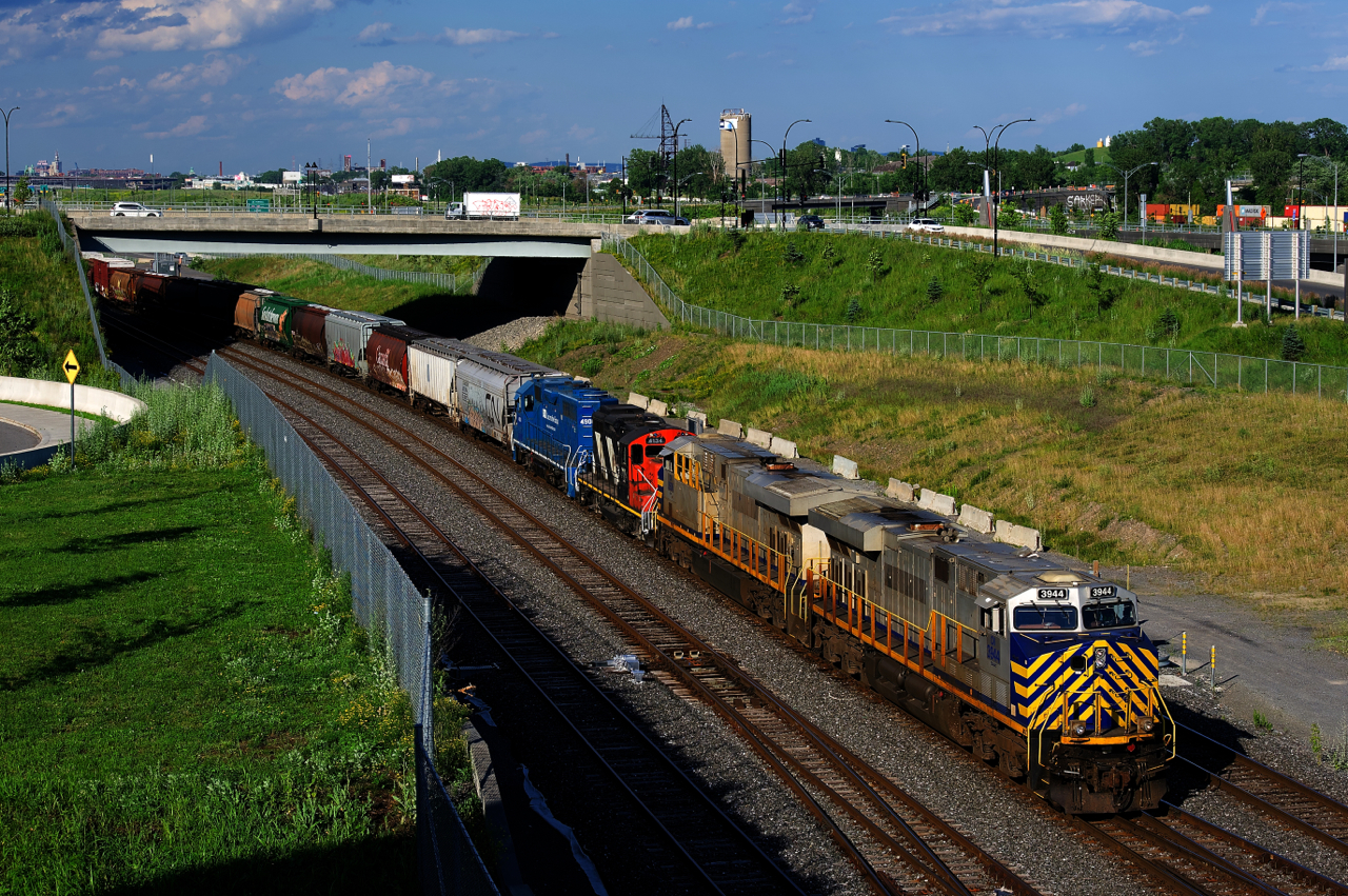 CN 527 has pair of CREX units followed by a pair of geeps (CN 3944, CN 3936, CN 4134 & CN 4900) as it backs up towards Track 29 to set off cars there.