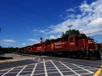 CP G95 is eastbound on normally passenger-only trackage as it passes the out of use Montreal West tower. It will soon cross over, then backup towards the South Jct lead at far left. This is the easiest way for G95 to reach CAD, for which it has five units. Full lashup is CP 3100, CP 2257, CP 8624, CP 9618, CP 8053, LTEX 1087 & CP 8074.