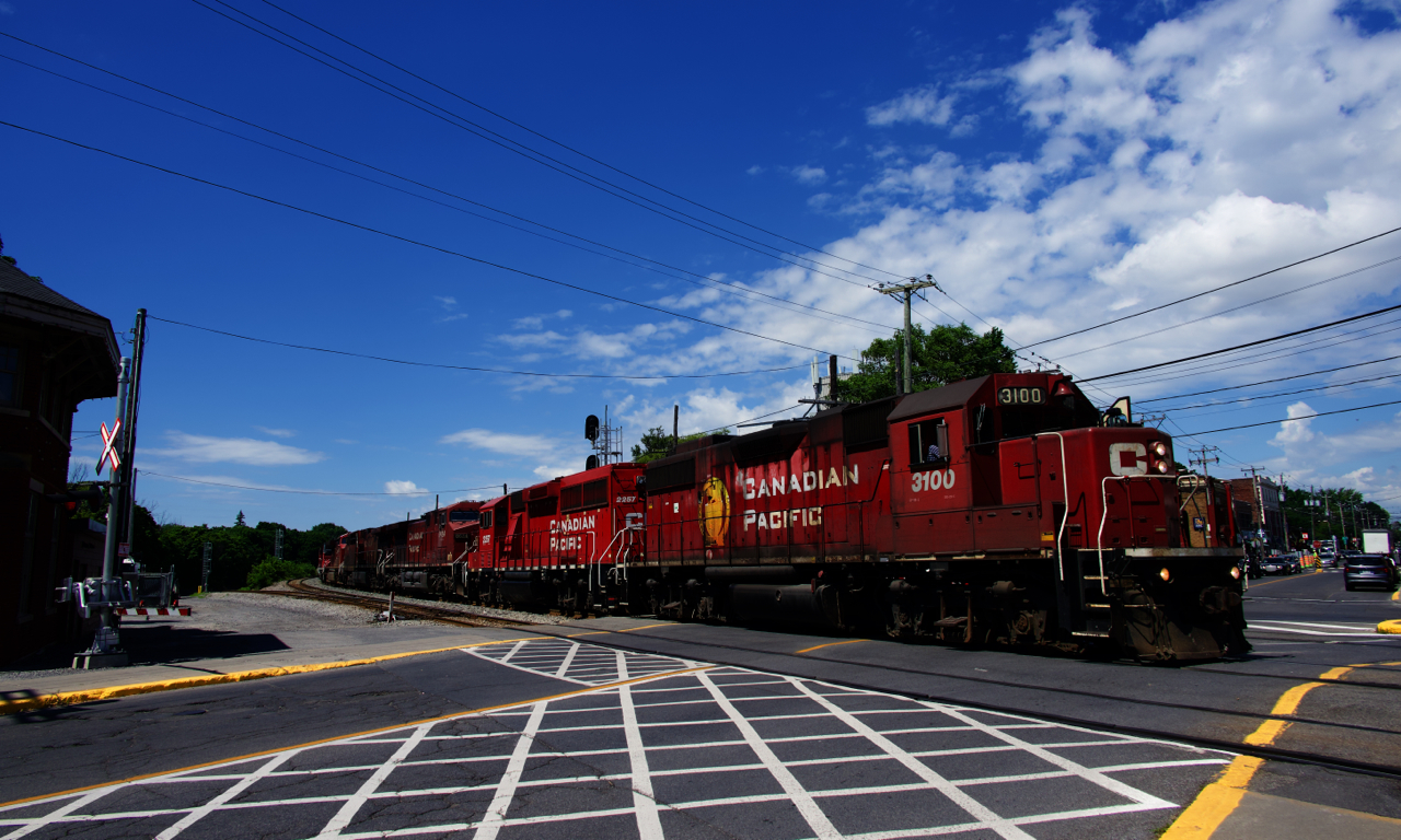 CP G95 is eastbound on normally passenger-only trackage as it passes the out of use Montreal West tower. It will soon cross over, then backup towards the South Jct lead at far left. This is the easiest way for G95 to reach CAD, for which it has five units. Full lashup is CP 3100, CP 2257, CP 8624, CP 9618, CP 8053, LTEX 1087 & CP 8074.